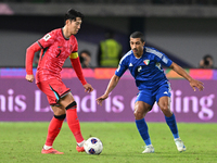 Sami Alsanea of Kuwait plays against Son Heung Min of Korea Republic during the AFC Asian Qualifiers Road to 26 match between Kuwait and Kor...