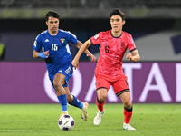 Yosef Alshammari of Kuwait competes against Hwang Inbeom of Korea Republic during the AFC Asian Qualifiers Road to 26 match between Kuwait a...