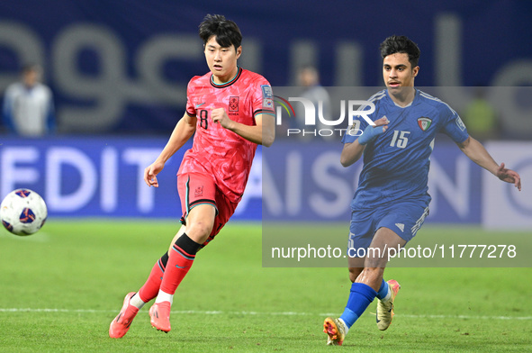 Yosef Alshammari of Kuwait competes against Park Yongwoo of Korea Republic during the AFC Asian Qualifiers Road to 26 match between Kuwait a...