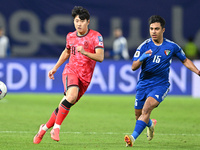 Yosef Alshammari of Kuwait competes against Park Yongwoo of Korea Republic during the AFC Asian Qualifiers Road to 26 match between Kuwait a...