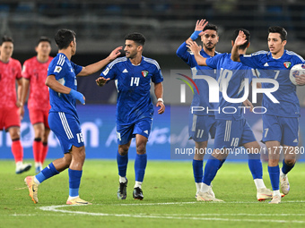 Players of Kuwait celebrate after scoring a goal during the AFC Asian Qualifiers Road to 26 match between Kuwait and Korea Republic in Kuwai...