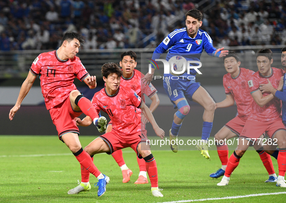 Salman Mohammed (C) of Kuwait competes against Cho Yumin (L) of Korea Republic during the AFC Asian Qualifiers Road to 26 match between Kuwa...