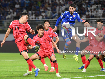 Salman Mohammed (C) of Kuwait competes against Cho Yumin (L) of Korea Republic during the AFC Asian Qualifiers Road to 26 match between Kuwa...