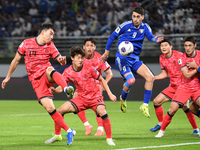 Salman Mohammed (C) of Kuwait competes against Cho Yumin (L) of Korea Republic during the AFC Asian Qualifiers Road to 26 match between Kuwa...