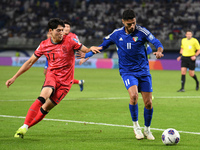 Eid Alrashidi of Kuwait competes against Bae Junho of Korea Republic during the AFC Asian Qualifiers Road to 26 match between Kuwait and Kor...