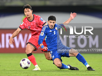 Moaath Aldhafiri of Kuwait competes against Paik Seungho of Korea Republic during the AFC Asian Qualifiers Road to 26 match between Kuwait a...