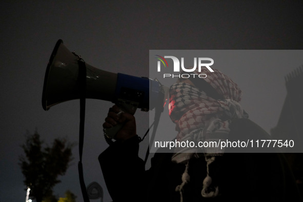 Demonstrators take part in a pro-Palestinian rally on the Place Du Front Populaire in Paris, France, on November 14, 2024, right before the...