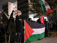 Demonstrators take part in a pro-Palestinian rally on the Place Du Front Populaire in Paris, France, on November 14, 2024, right before the...