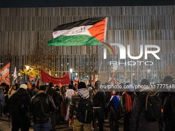 Demonstrators take part in a pro-Palestinian rally on the Place Du Front Populaire in Paris, France, on November 14, 2024, right before the...