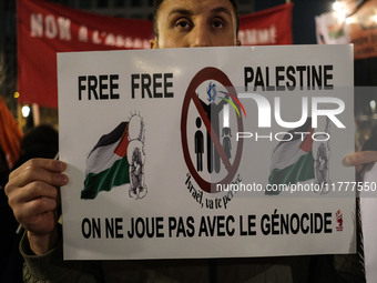 Demonstrators take part in a pro-Palestinian rally on the Place Du Front Populaire in Paris, France, on November 14, 2024, right before the...