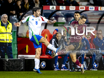 Italy midfielder Sandro Tonali and Belgium defender Timothy Castagne play during the match between Belgium and Italy at the King Baudouin St...