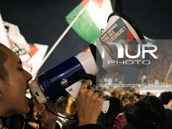 Demonstrators take part in a pro-Palestinian rally on the Place Du Front Populaire in Paris, France, on November 14, 2024, right before the...