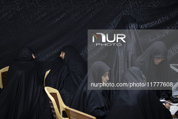 Veiled Iranian women participate in a charity ceremony to donate gold and money to help the Lebanese Resistance Front and its affected peopl...