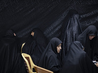 Veiled Iranian women participate in a charity ceremony to donate gold and money to help the Lebanese Resistance Front and its affected peopl...