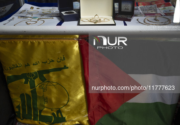 Gold, jewelry, and U.S. dollar banknotes donated by veiled women during a charity ceremony to help the Lebanese Resistance Front and its aff...