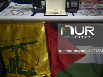 Gold, jewelry, and U.S. dollar banknotes donated by veiled women during a charity ceremony to help the Lebanese Resistance Front and its aff...