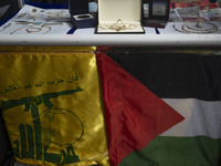 Gold, jewelry, and U.S. dollar banknotes donated by veiled women during a charity ceremony to help the Lebanese Resistance Front and its aff...