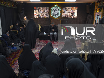 Veiled Iranian women participate in a charity ceremony to donate gold and money to help the Lebanese Resistance Front and its affected peopl...