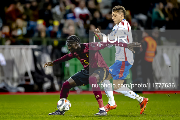 Belgium midfielder Amadou Onana and Italy defender Alessandro Buongiorno play during the match between Belgium and Italy at the King Baudoui...