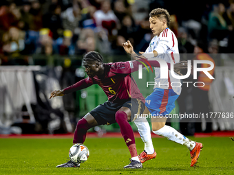 Belgium midfielder Amadou Onana and Italy defender Alessandro Buongiorno play during the match between Belgium and Italy at the King Baudoui...