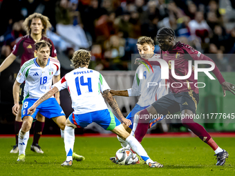 Belgium midfielder Amadou Onana and Italy defender Alessandro Buongiorno play during the match between Belgium and Italy at the King Baudoui...