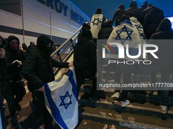 Supporters with Israeli flags queue outside the Stade de France stadium ahead of the UEFA Nations League League A, Group A2 football match b...