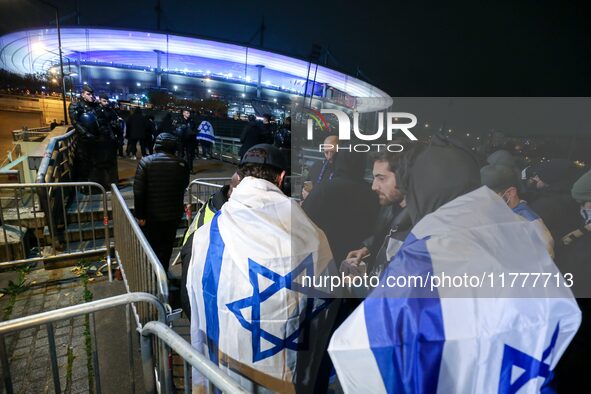 Supporters with Israeli flags queue outside the Stade de France stadium ahead of the UEFA Nations League League A, Group A2 football match b...