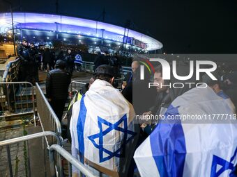 Supporters with Israeli flags queue outside the Stade de France stadium ahead of the UEFA Nations League League A, Group A2 football match b...