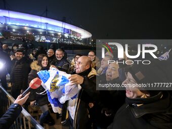 Supporters with Israeli flags queue outside the Stade de France stadium ahead of the UEFA Nations League League A, Group A2 football match b...