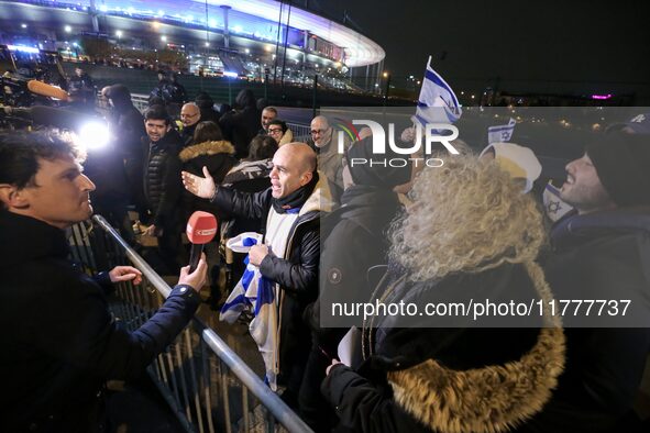 Supporters with Israeli flags queue outside the Stade de France stadium ahead of the UEFA Nations League League A, Group A2 football match b...