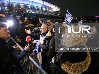 Supporters with Israeli flags queue outside the Stade de France stadium ahead of the UEFA Nations League League A, Group A2 football match b...