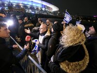 Supporters with Israeli flags queue outside the Stade de France stadium ahead of the UEFA Nations League League A, Group A2 football match b...