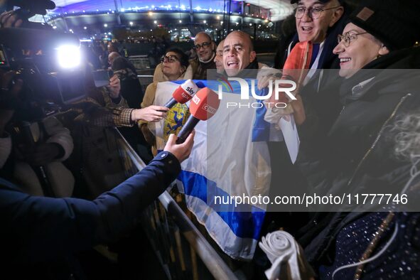 Supporters with Israeli flags queue outside the Stade de France stadium ahead of the UEFA Nations League League A, Group A2 football match b...