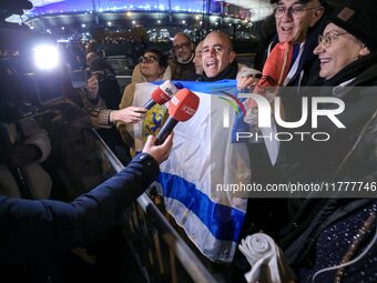 Supporters with Israeli flags queue outside the Stade de France stadium ahead of the UEFA Nations League League A, Group A2 football match b...