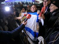 Supporters with Israeli flags queue outside the Stade de France stadium ahead of the UEFA Nations League League A, Group A2 football match b...