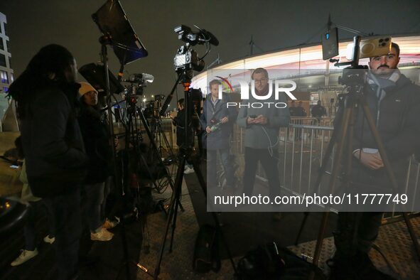 French and foreign media conduct a live broadcast in front of the Stade de France stadium ahead of the UEFA Nations League League A, Group A...