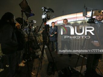 French and foreign media conduct a live broadcast in front of the Stade de France stadium ahead of the UEFA Nations League League A, Group A...