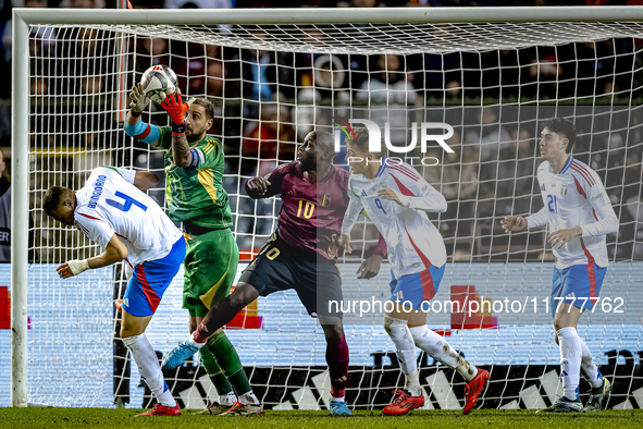 Italy goalkeeper Gianluigi Donnarumma, Belgium forward Romelu Lukaku, and Italy defender Alessandro Buongiorno participate in the match betw...