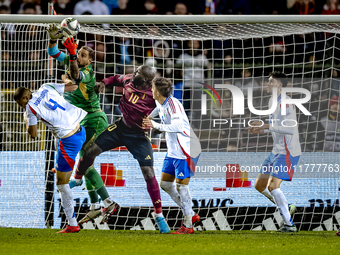 Italy goalkeeper Gianluigi Donnarumma, Belgium forward Romelu Lukaku, and Italy defender Alessandro Buongiorno participate in the match betw...