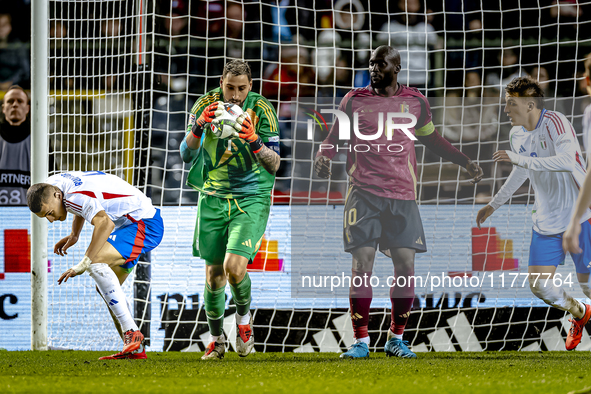 Italy goalkeeper Gianluigi Donnarumma, Belgium forward Romelu Lukaku, and Italy defender Alessandro Buongiorno participate in the match betw...