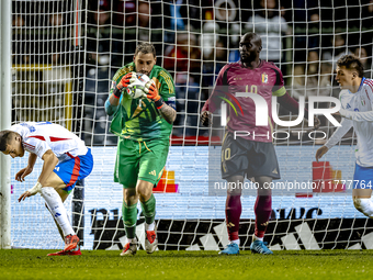 Italy goalkeeper Gianluigi Donnarumma, Belgium forward Romelu Lukaku, and Italy defender Alessandro Buongiorno participate in the match betw...