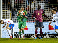 Italy goalkeeper Gianluigi Donnarumma, Belgium forward Romelu Lukaku, and Italy defender Alessandro Buongiorno participate in the match betw...