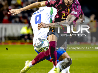 Italy forward Mateo Retegui and Belgium defender Zeno Debast play during the match between Belgium and Italy at the King Baudouin Stadium fo...