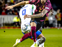 Italy forward Mateo Retegui and Belgium defender Zeno Debast play during the match between Belgium and Italy at the King Baudouin Stadium fo...