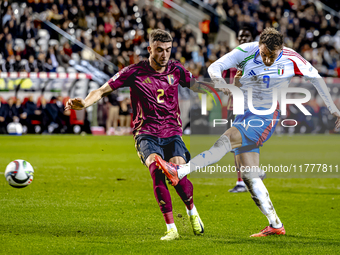 Italy forward Mateo Retegui and Belgium defender Zeno Debast play during the match between Belgium and Italy at the King Baudouin Stadium fo...