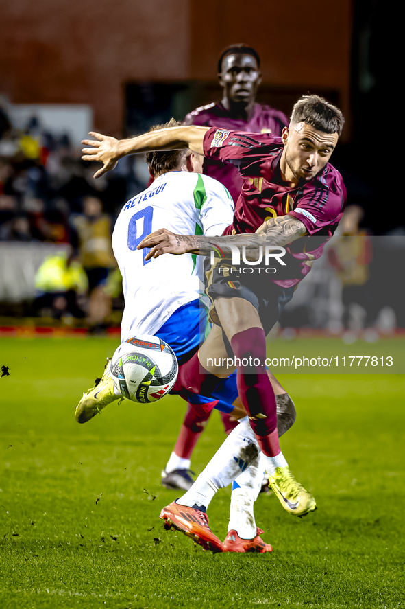 Italy forward Mateo Retegui and Belgium defender Zeno Debast play during the match between Belgium and Italy at the King Baudouin Stadium fo...