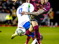 Italy forward Mateo Retegui and Belgium defender Zeno Debast play during the match between Belgium and Italy at the King Baudouin Stadium fo...