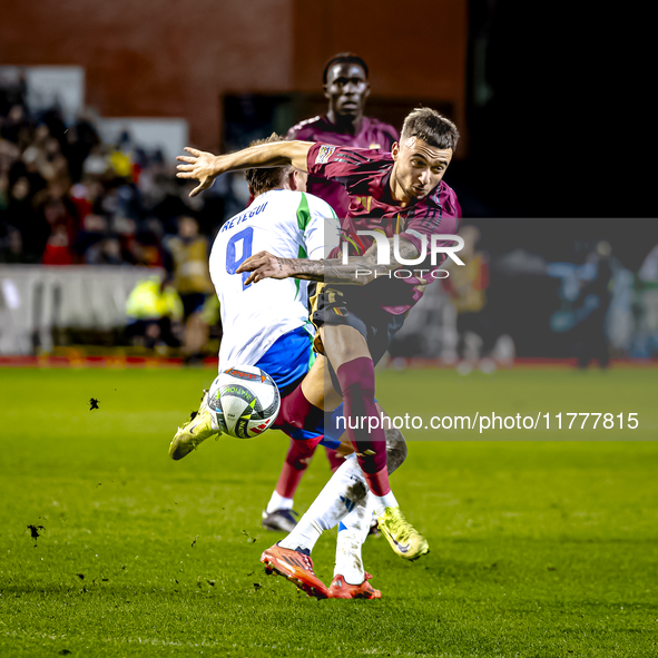 Italy forward Mateo Retegui and Belgium defender Zeno Debast play during the match between Belgium and Italy at the King Baudouin Stadium fo...