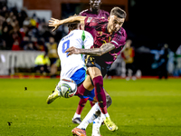 Italy forward Mateo Retegui and Belgium defender Zeno Debast play during the match between Belgium and Italy at the King Baudouin Stadium fo...