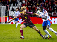 Belgium defender Wout Faes and Italy forward Moise Kean play during the match between Belgium and Italy at the King Baudouin Stadium for the...